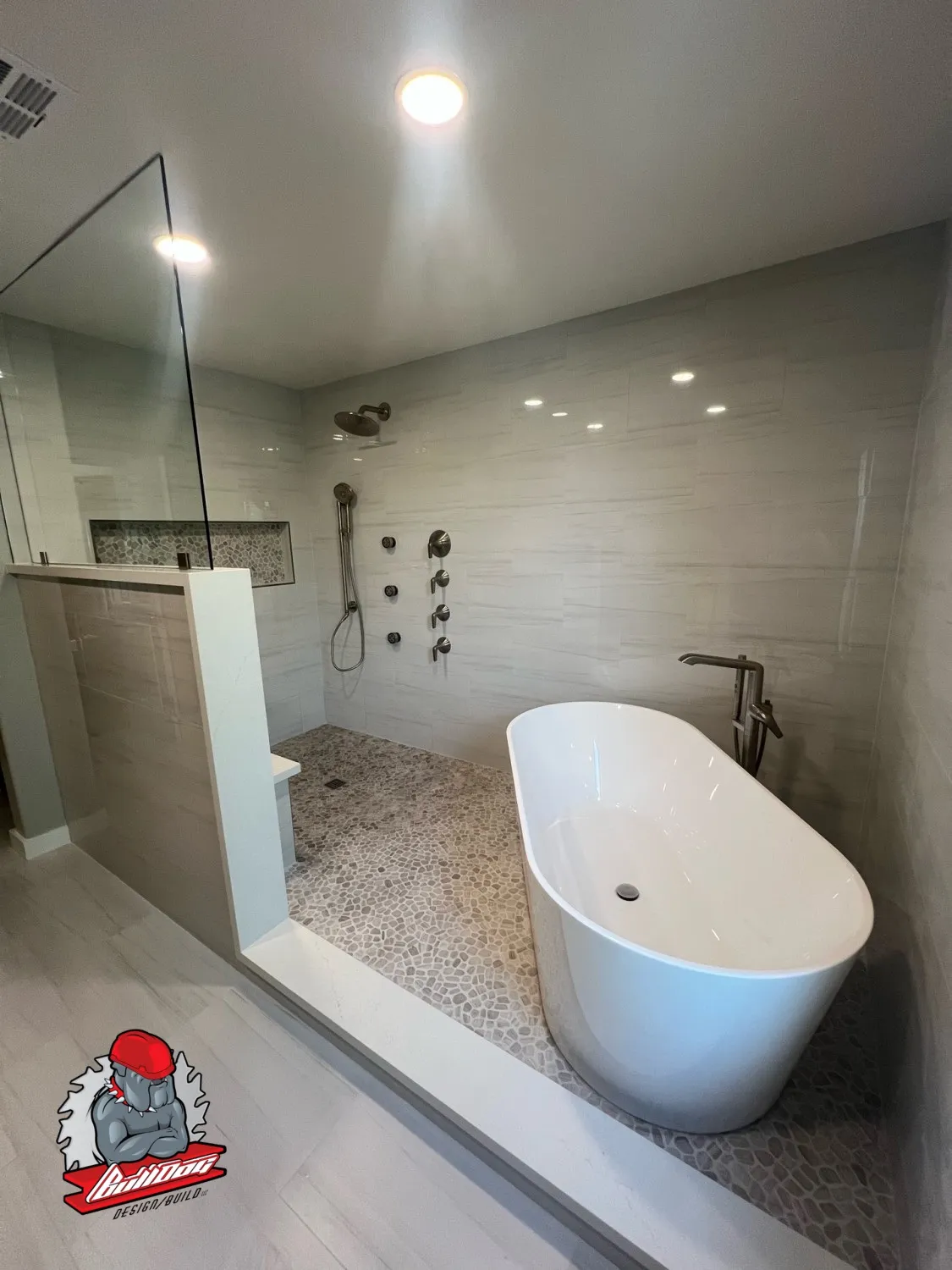 Modern bathroom remodel with freestanding tub and tiled walk-in shower
