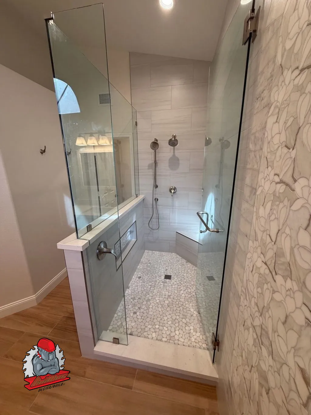 Bathroom with frameless glass walk-in shower and marble-look tile